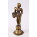 A SOUTH INDIAN BRASS OIL LAMP FIGURE OF LAKSHMI.