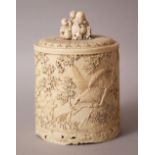A GOOD JAPANESE MEIJI PERIOD CARVED IVORY TUSK POT & COVER, the body of the tusk carved in deep