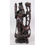 A GOOD 19TH / 20TH CENTURY CHINESE HARDWOOD & SILVER INLAID FIGURE OF GUANYIN & DEER, stood upon a
