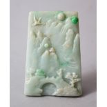 A CHINESE CARVED JADEITE TABLET / PENDANT OF LANDSCAPE SCENE, 7cm high x 4.5cm wide.