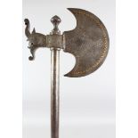 A 19TH CENTURY PERSIAN QAJAR GOLD INLAID STEEL AXE, 72cm long.