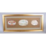 A VERY GOOD SET OF THREE INDIAN MINIATURE OVAL PORTRAITS ON IVORY in a large frame, 10cm x 16cm
