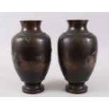 A GOOD PAIR OF JAPANESE MEIJI PERIOD BRONZE & MIXED METAL VASES, decorated with scenes of birds in