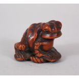 A GOOD JAPANESE MEIJI PERIOD CARVED WOODEN NETSUKE OF A TOAD ON A SANDAL, possibly the work of