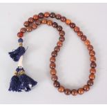 A 19TH CENTURY QING DYNASTY CHINESE RHINOCEROS HORN & AMBER ROSARY BEADS / NECKLACE , comprising