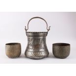 A PERSIAN ISLAMIC TINNED COPPER BUCKET AND TWO BOWLS.