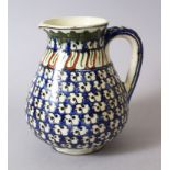 A 19TH CENTURY IZNIK POTTERY JUG, 19cm high.