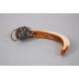 A 19TH CENTURY METAL & ENAMEL MOUNTED BOARS TOOTH, the boars tooth with applied metal design