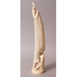 A GOOD JAPANESE MEIJI PERIOD CARVED IVORY OKIMONO OF A FISHERMAN REPAIRING HIS NET, the man