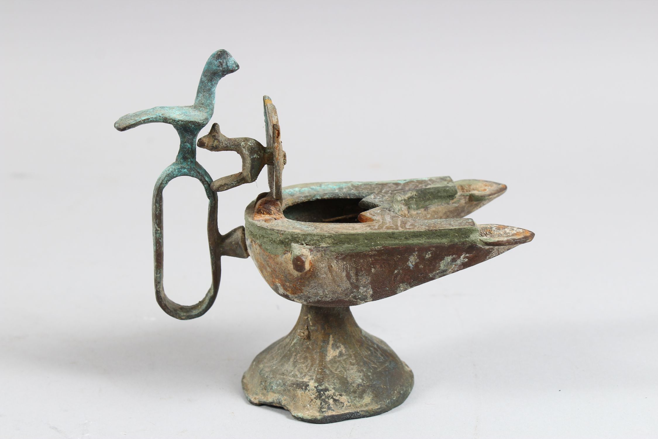 A 12TH CENTURY SELJUK BRONZE OIL LAMP with two bird finials, 12cm high. - Image 3 of 4