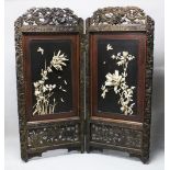 A LARGE JAPANESE MEIJI PERIOD TWO-FOLD HARDWOOD & SHIBAYAMA SCREEN, , the panels decorated in high