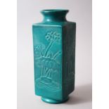 A CHINESE SQUARE FORMED KANGXI STYLE TURQUOISE / GREEN GROUND PORCELAIN VASE, the panneled