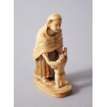A RARE INDIAN CARVED IVORY FIGURE OF A PARSI WOMAN AND CHILD, possibly Bombay early 19th Century.