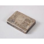 A GOOD CHINESE WHITE METAL WEIGHT, the rear with inscriptions, the front with two roundel's, 2cm x 3