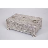 A GOOD FILEGREE SILVER RECTANGULAR BOX AND HINGED COVER with scroll and other decoration, 14cm long,
