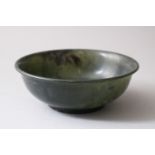 A 19TH / 20TH CENTURY CHINESE SPINACH GREEN JADE BOWL, the base with a chinese script mark, 12.5cm