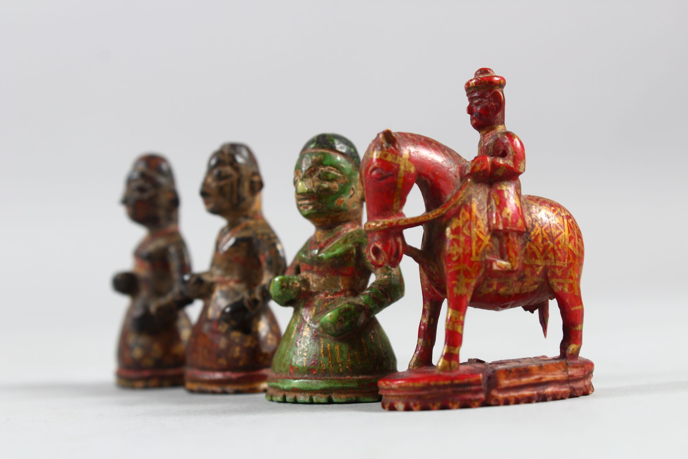 A COLLECTION OF FOUR 17TH CENTURY INDIAN POYCHROME IVORY CHESS PIECES, 5cm high. - Image 4 of 4