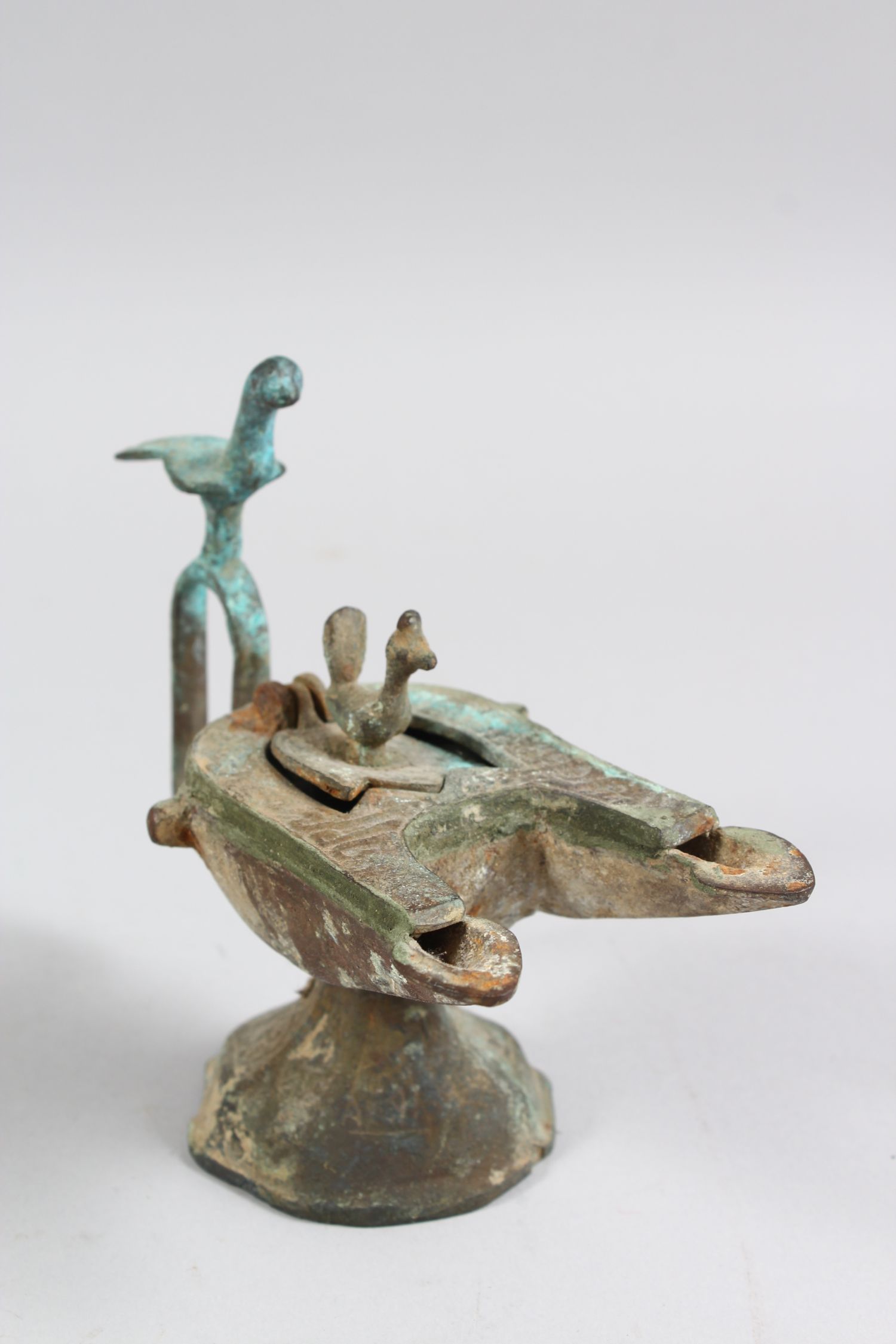 A 12TH CENTURY SELJUK BRONZE OIL LAMP with two bird finials, 12cm high. - Image 2 of 4