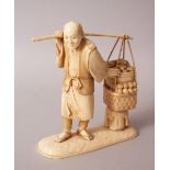 A GOOD JAPANESE MEIJI PERIOD CARVED IVORY OKIMONO OF A BASKET MAN, the man stood on a simulated