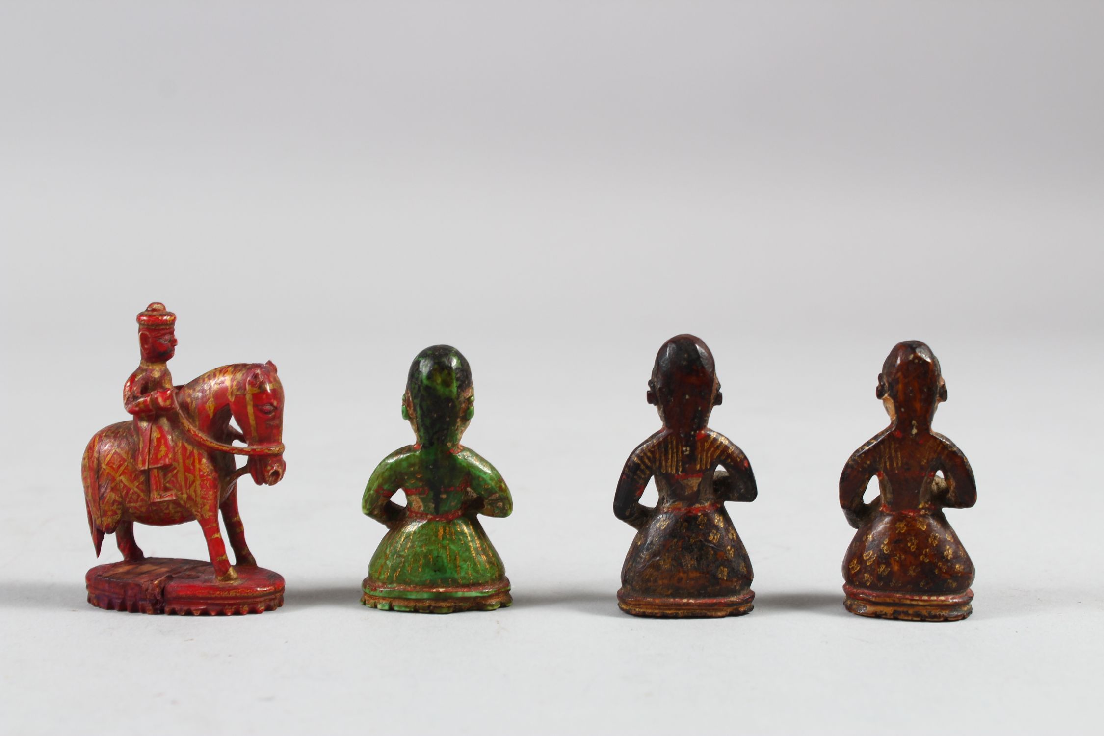 A COLLECTION OF FOUR 17TH CENTURY INDIAN POYCHROME IVORY CHESS PIECES, 5cm high. - Image 2 of 4