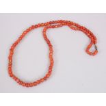 AN ISLAMIC CORNELIAN BEAD NECKLACE, 13th Century or later, 72cm long.