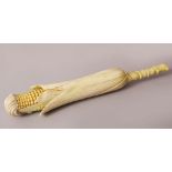 A JAPANESE MEIJI PERIOD CARVED & STAINED IVORY OKIMONO OF A CORN COB, the corn with its stalk,