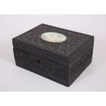 A GOOD INDIAN CARVED EBONY BOX, the lid with a miniature of The Taj Mahal, 15cm long.