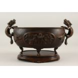 A 19TH CENTURY CHINESE BRONZE CENSER ON STAND, the censor with twin lion dog handles, with on laid