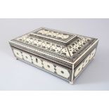 A VERY GOOD INDIAN MOSAIC WORK BOX with fitted interior on four ball feet, 26cm long, 18cm deep, 9cm