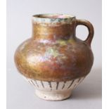 A 12TH-13TH CENTURY PERSIAN KASHAN OR SYRIAN GOLD SPLASH POTTERY JUG, 17cm high.