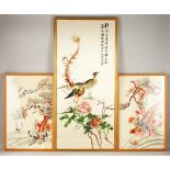 THREE ORIENTAL FRAMED SILK EMBROIDERED PICTURES OF PEACOCKS & CRANES, the smaller pair depicting