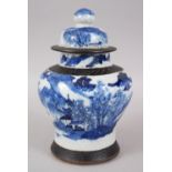 A 19TH CENTURY CHINESE BLUE AND WHITE CRACKLE GLAZE GINGER JAR & COVER, decorated with landscape