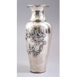 A GOOD CHINESE SOLID SILVER VASE, the body decorated in relief with scenes of birds amongst floral