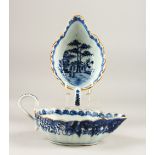 A PAIR OF 18TH CENTURY QIANLONG BLUE & WHITE SAUCE BOATS, decorated with floral landscape scenes,