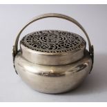 AN EARLY 20TH CENTURY CHINESE PAKTONG WHITE METAL HAND WARMER, the top with a pierced lid