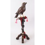 A JAPANESE MEIJI PERIOD BRONZE & MIXED METAL HAWK ON STAND, the hawk with gilded detailing sat