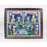 A 19TH CENTURY PERSIAN QAJAR GLAZED POTTERY TILE, with many figures, 36cm x 46cm in a wooden frame.