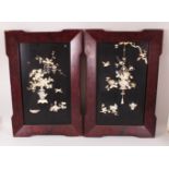 A PAIR OF JAPANESE MEIJI PERIOD SHIBAYAMA IVORY INLAID PANELS, the panels with carved & stained