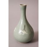 A SMALL 20TH CENTURY CHINESE CELADON CRACKLE GLAZE PORCELAIN BOTTLE VASE, with flying birds and