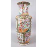 A GOOD 19TH CENTURY CHINESE CANTON FAMILLE ROSE PORCELAIN VASE, with twin lion dog head handles, the