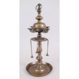 A LATE 17TH CENTURY ISLAMIC BRONZE OIL LAMP, 48cm high.