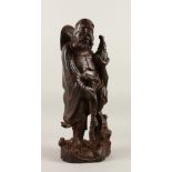 A GOOD CHINESE CARVED HARDWOOD ( ZITAN ) FIGURE OF AN IMMORTAL, stood holding a gourd in one hand