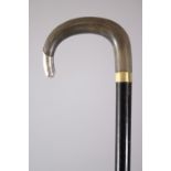 A GOOD CHINESE HORN HANDLED & SILVER MOUNTED WALKING STICK, possibly rhinoceros horn?, 68.5cm high.