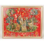 A FRAMED AND GLAZED BRUSSELS NEEDLEWORK with two ladies, unicorn and flowers on a red background.