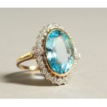 A 9CT GOL, DIAMOND AND BLUE TOPAZ LARGE CLUSTER RING.