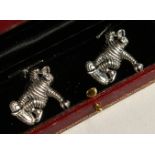 A PAIR OF SILVER MICHELIN MAN CUFFLINKS.