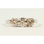 AN 18CT WHITE GOLD THREE STONE DIAMOND RING of 1.1cts.