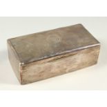 A LARGE ENGINE TURNED SILVER CIGARETTE CASE. 17cms long. London 1911.