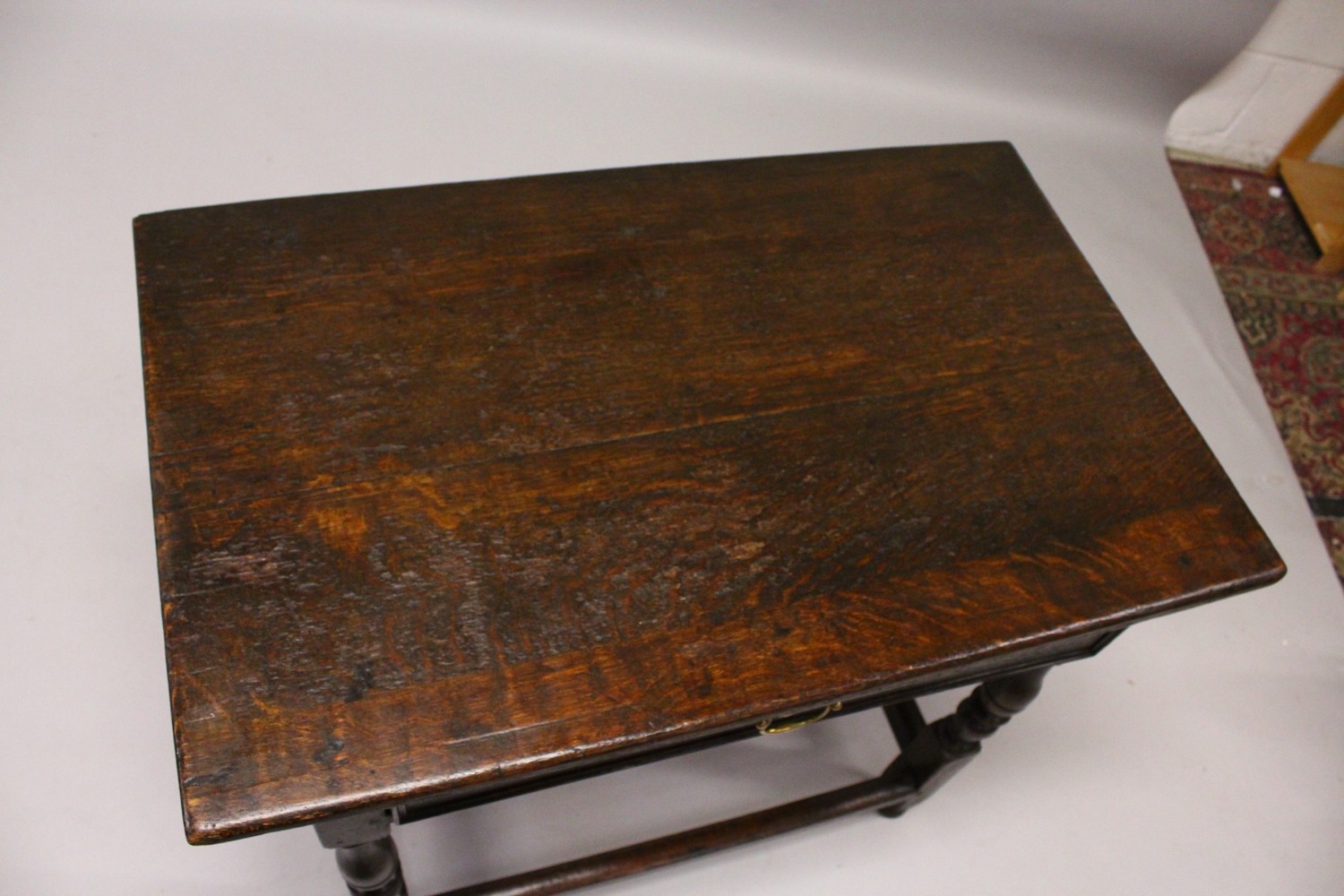 AN 18TH CENTURY OAK SIDE TABLE, with a single long drawer, on turned legs united by stretchers. 84cm - Image 2 of 11