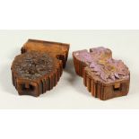 TWO CARVED TREEN WATCH CASES.